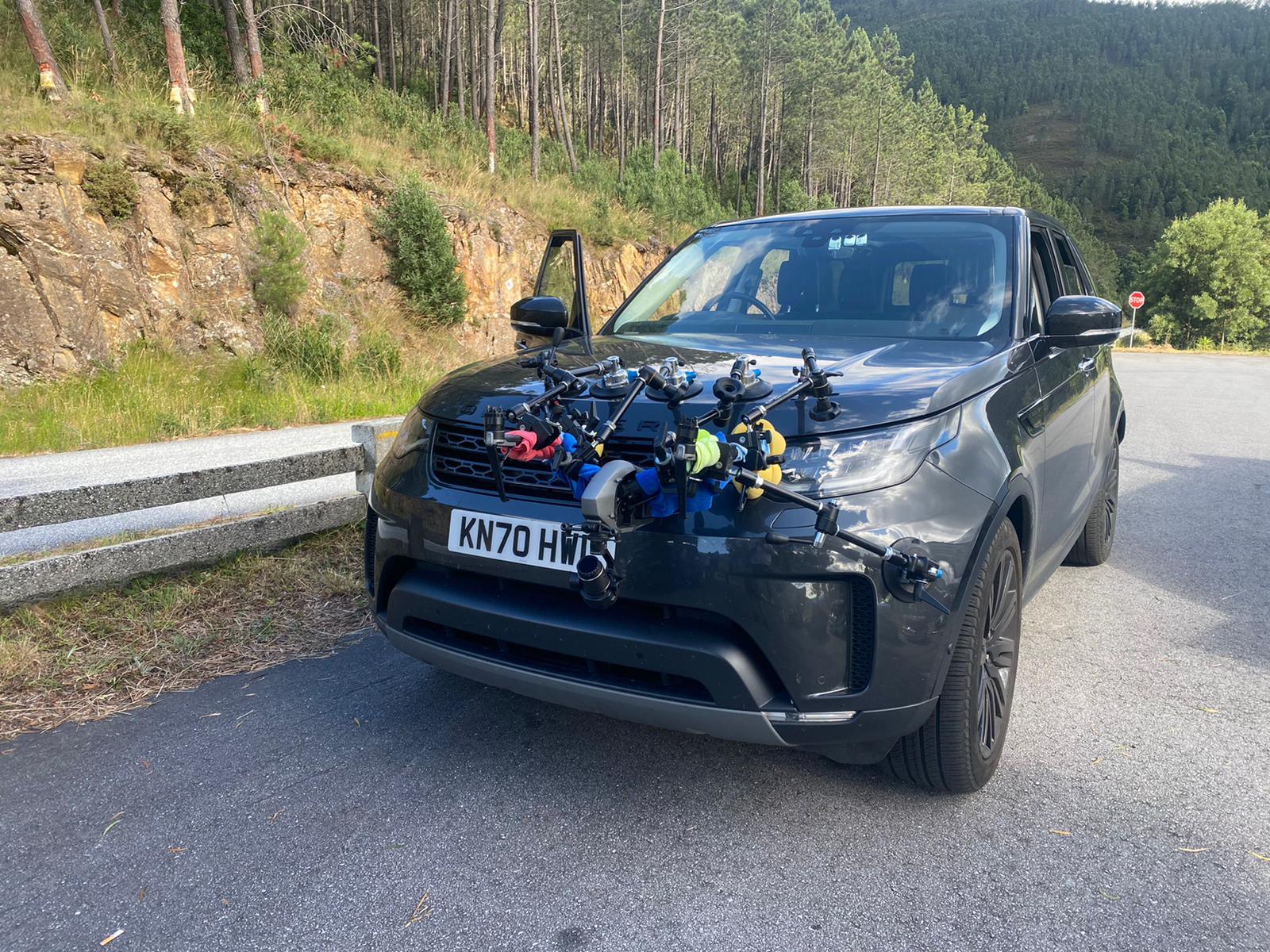 mack logistics driving film crew support and tracking vehicle on a  car film shoot